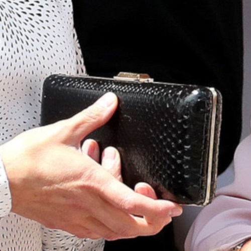 Queen Letizia carries black snakeskin box frame clutch