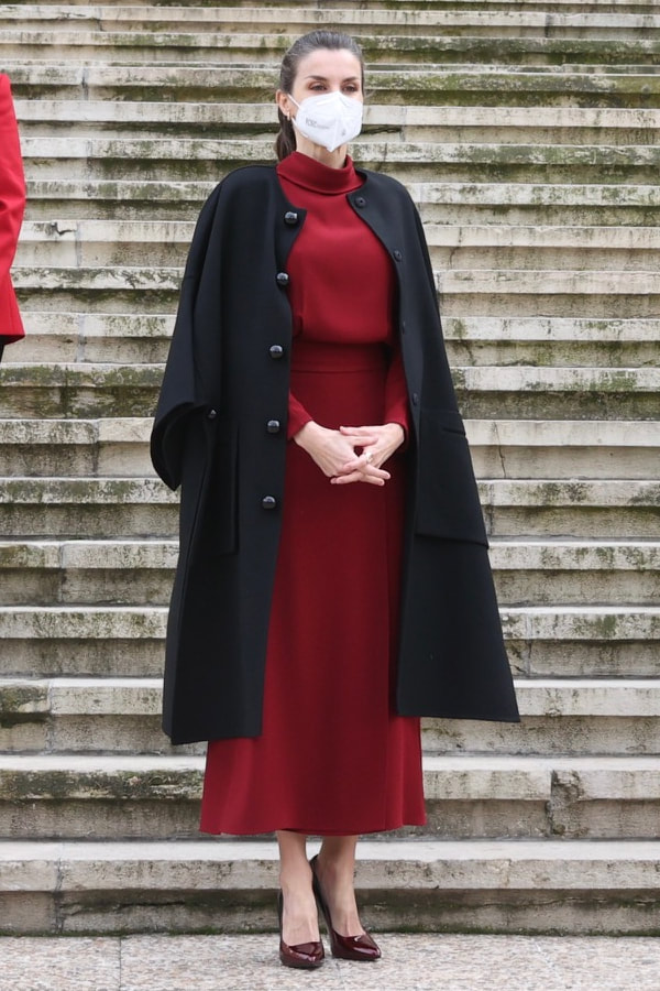 Queen Letizia arrives at the National Library of Spain wearing her black Carolina Herrera cape-inspired coat