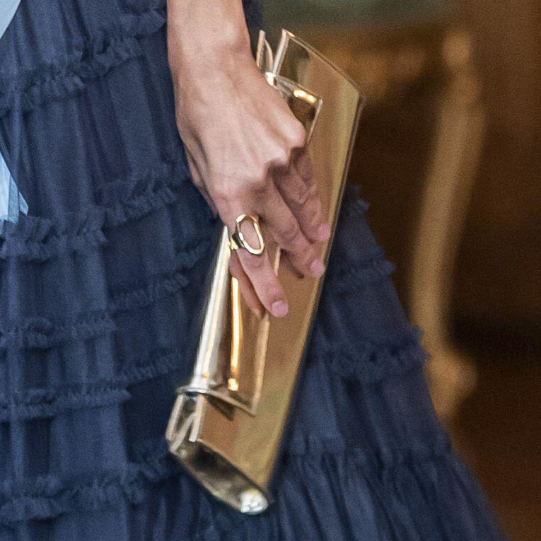 Queen Letizia carries metallic gold Magrit 'Alice' clutch