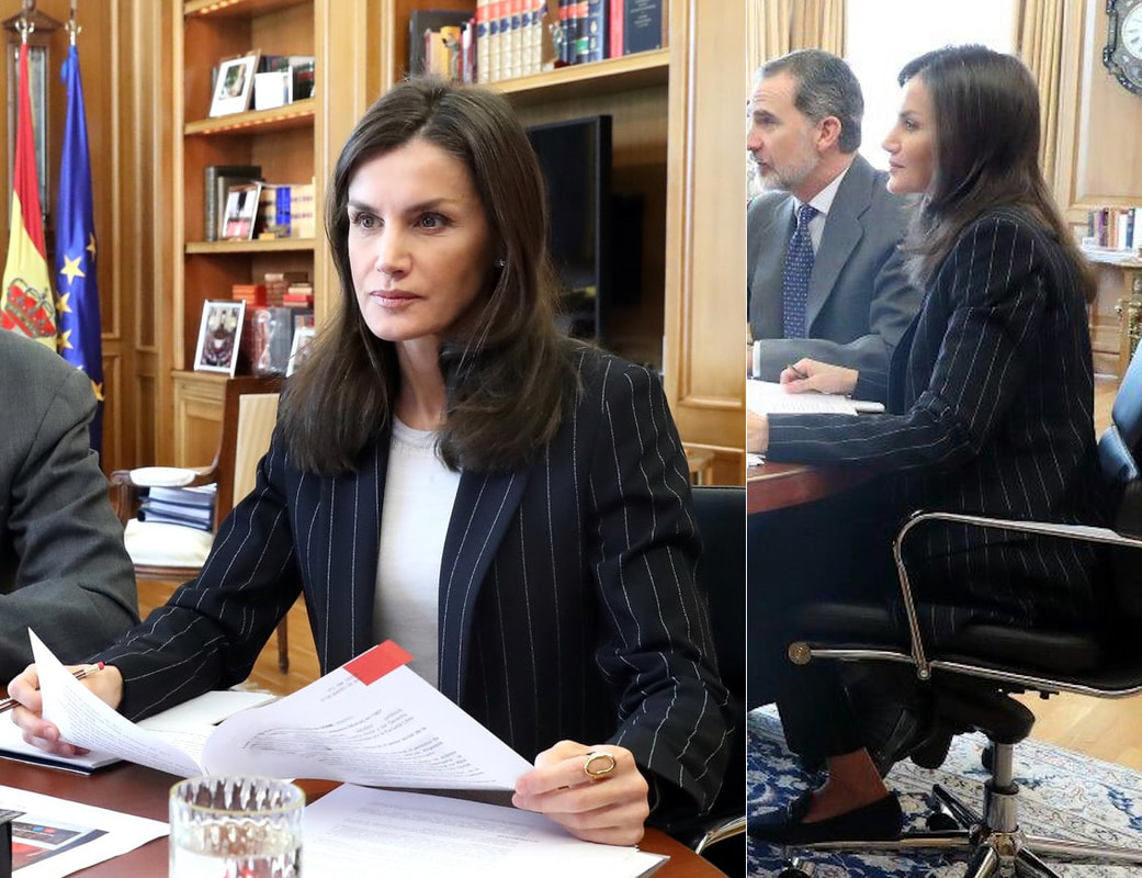 Queen Letizia wore a navy longline pinstripe blazer with navy trousers and a white crew-neck top.