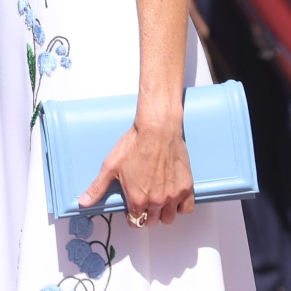 Queen Letizia carries Magrit flap clutch bag in powder blue leather