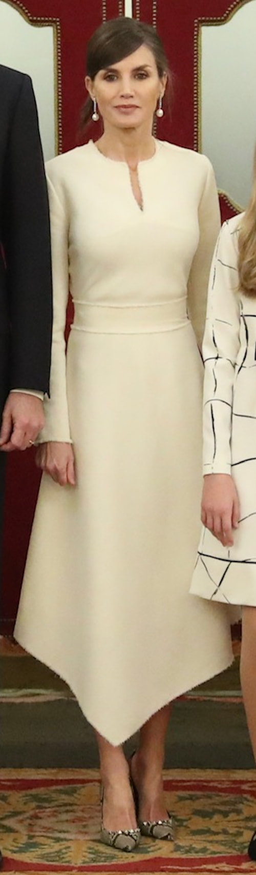 cream asymmetrical dress featuring frayed finishes for the for the Solemn Opening Ceremony of the XIV Legislature