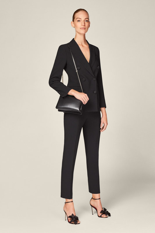 CH Carolina Herrera black crepe blazer suit with double-breasted blazer and slim trousers