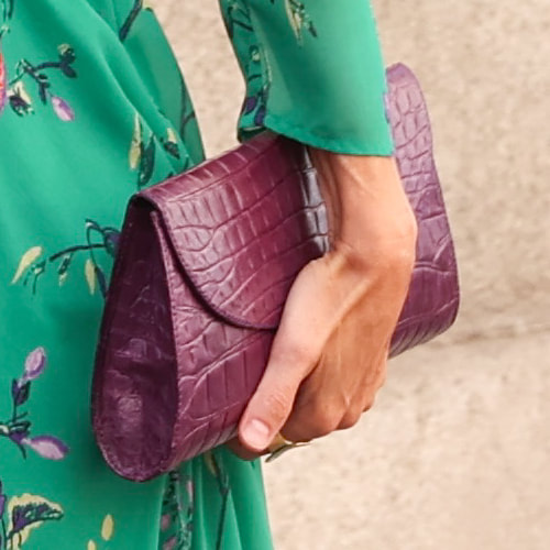 Queen Letizia carries Purple croc-effect clutch bag
