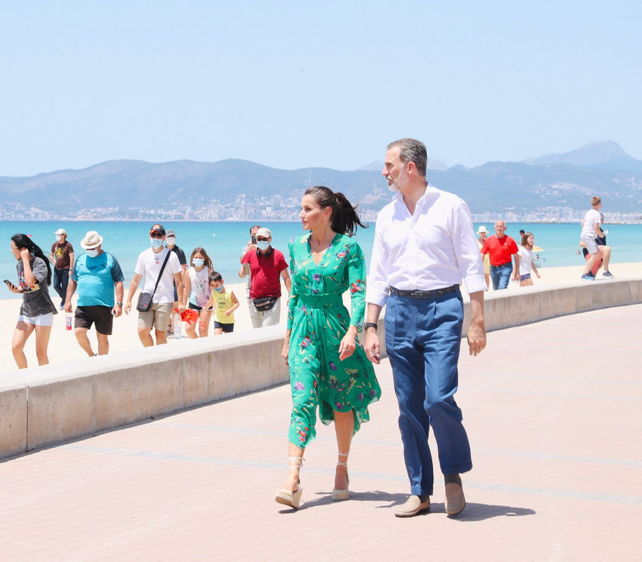 King Felipe VI and Queen Letizia walk the promenade of Playa de Palma in Majorca on 25 June 2020