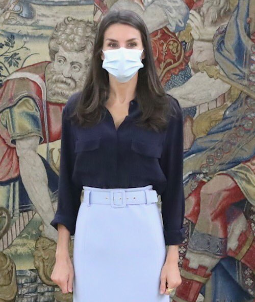 Queen Letizia wears navy satin shirt with flap chest pockets 