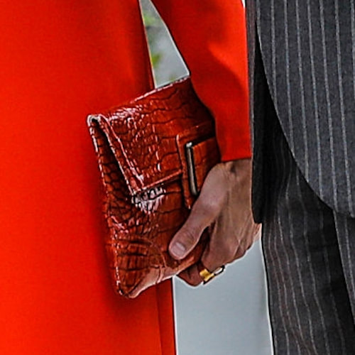 Queen Letizia carries Ángel Schlesser orange croc-embossed clutch