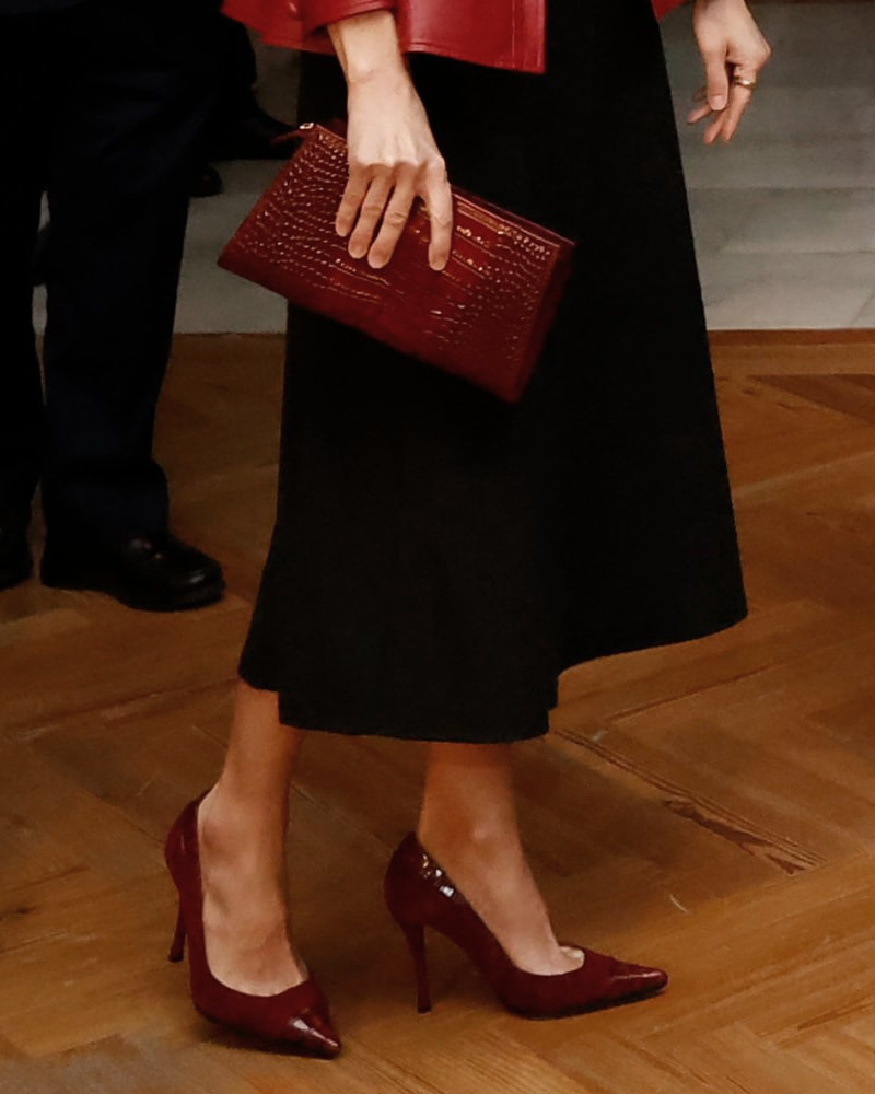 Queen Letizia wears Magrit 'Mara' crocodile effect leather clutch bag in burgundy and coordinating pumps in suede