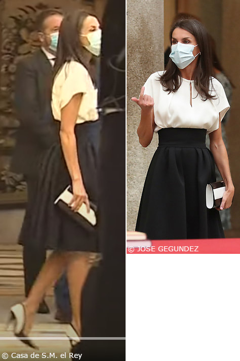 Queen Letizia teamed her black high-waist full-circle skirt with a white relaxed-fit keyhole blouse. Her Majesty accessorized with her custom black and white Magrit 'Ivi' leather clutch bag and matching pumps.