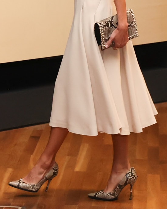 Queen Letizia wears Magrit studded snakeskin pumps and clutch