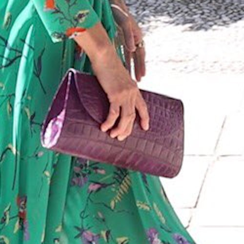Queen Letizia carries purple croc-effect clutch bag