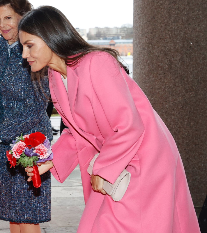 Queen Letizia wears pink Carolina Herrera oversized felt coat.
