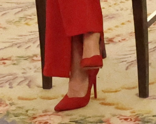 Queen Letizia wears Red suede pumps with a sweetheart cut out vamp