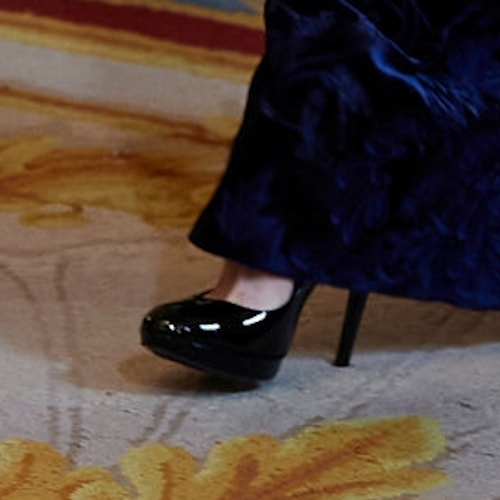 Queen Letizia wears Magrit black patent platform pumps