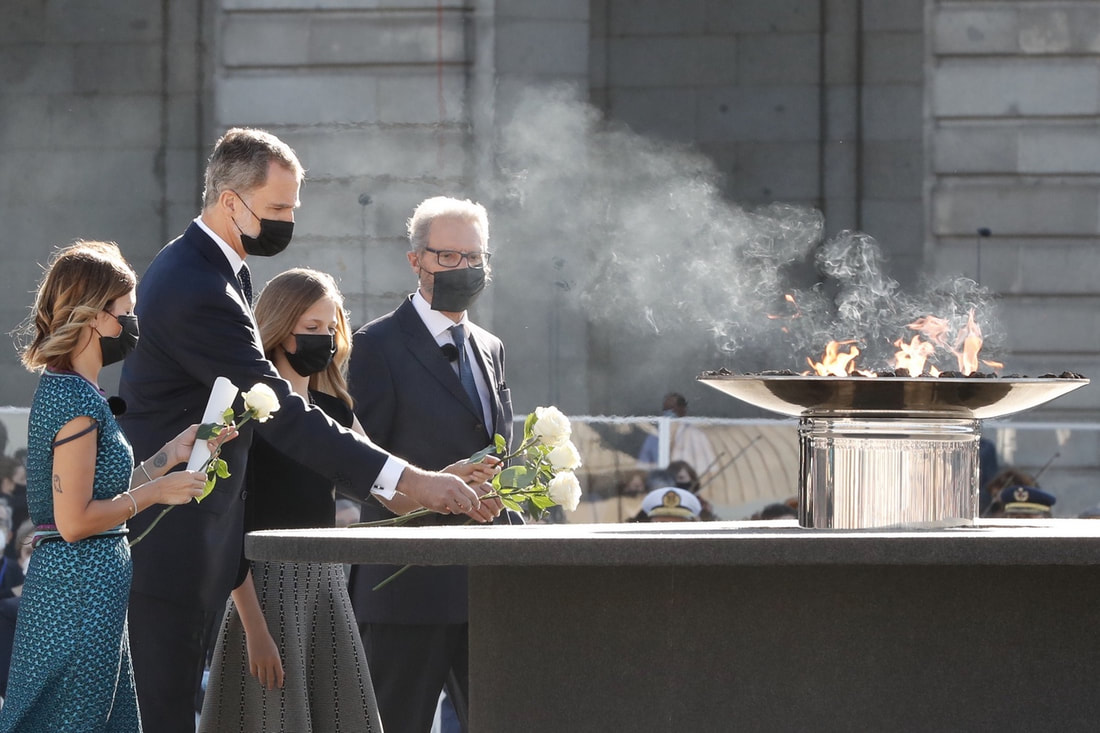 King Felipe VI and Leonor, Princess of Asturias, accompanied by the representatives of victims and health workers, laid white roses next to the cauldron